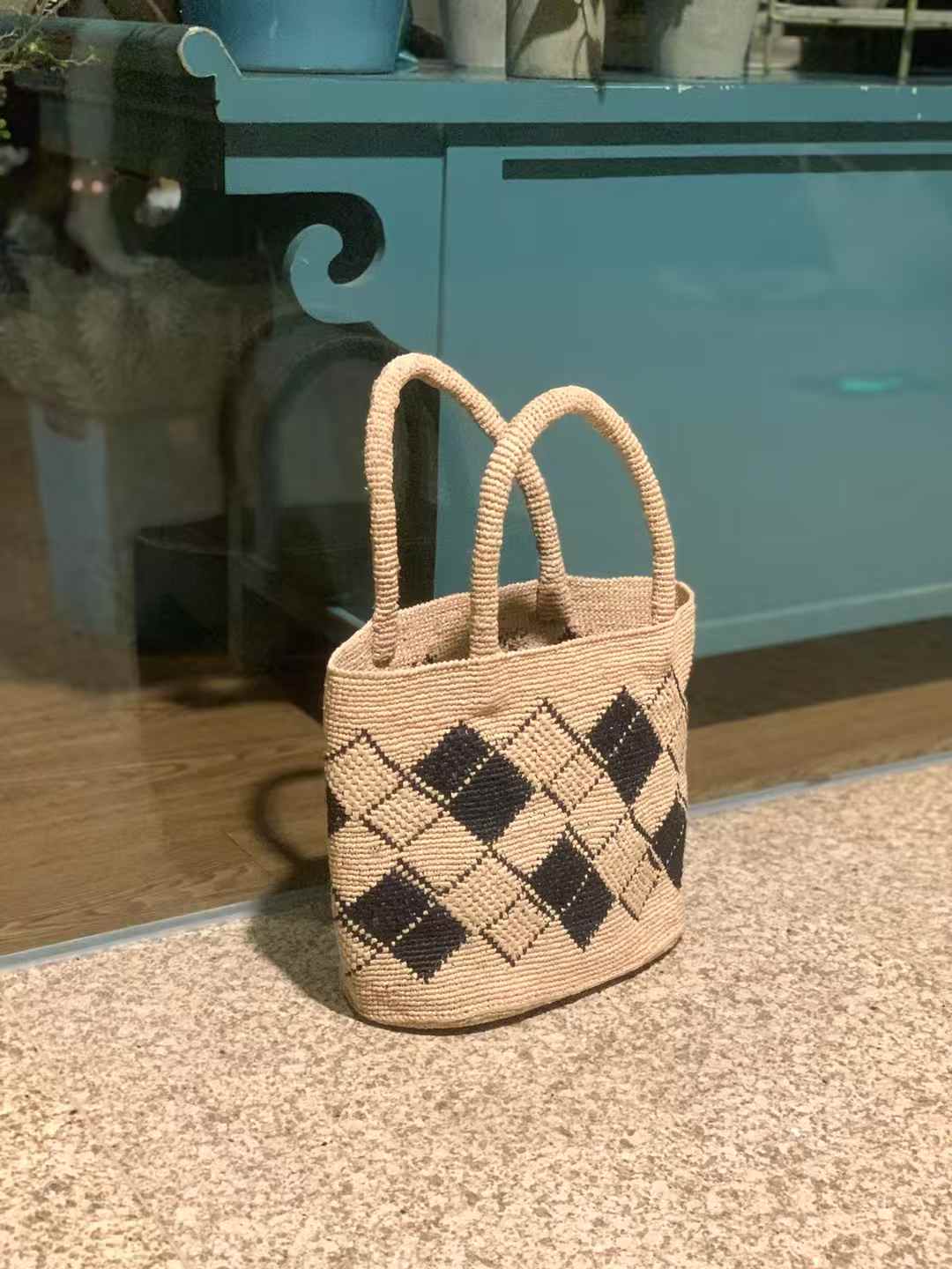 crochet straw bag features a classic tote shape with two sturdy top handles, in diamond pattern, perfect for hand carry or arm wear.