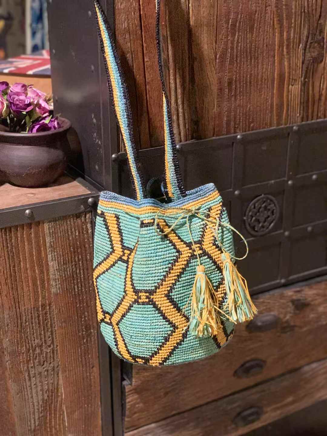 raffia bucket bag in geometric pattern