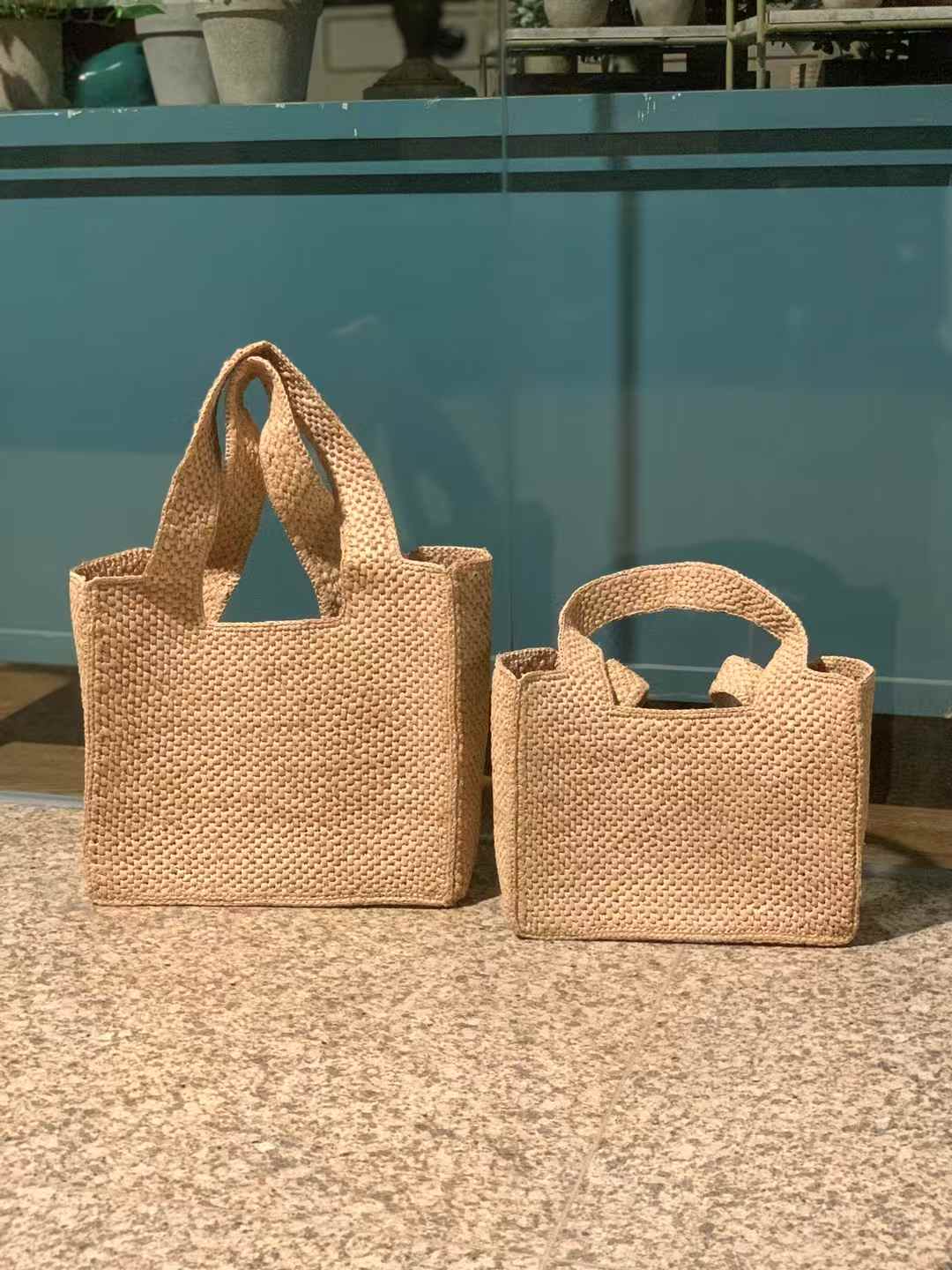 2 minimalist Raffia tote with top handles, rectangular shape, one in medium size and the other one is a mini tote