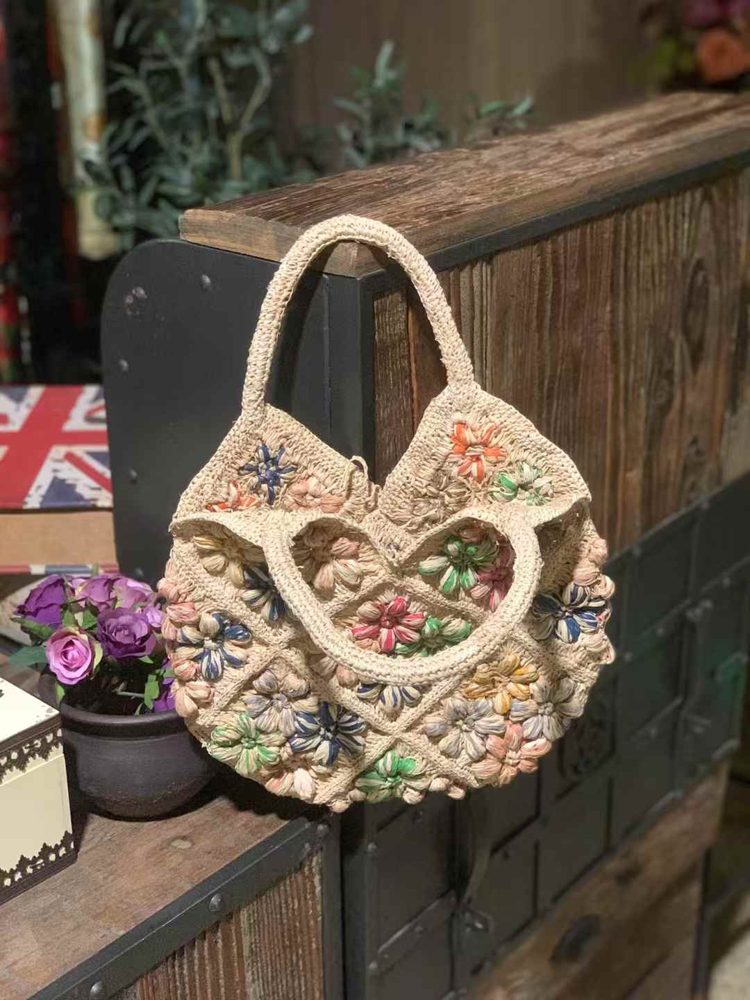 unique flower straw bag made in crochet technique with colorful crochet flower design, featuring natural tones, two top handles — perfect for summer beach or casual wear