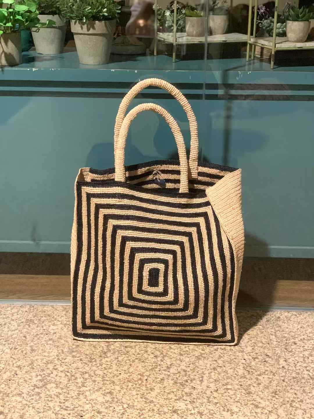 Raffia Straw Tote in Beige And Black Geometric Pattern, flat bottom, rectangular shape with 2 hand crochet handles