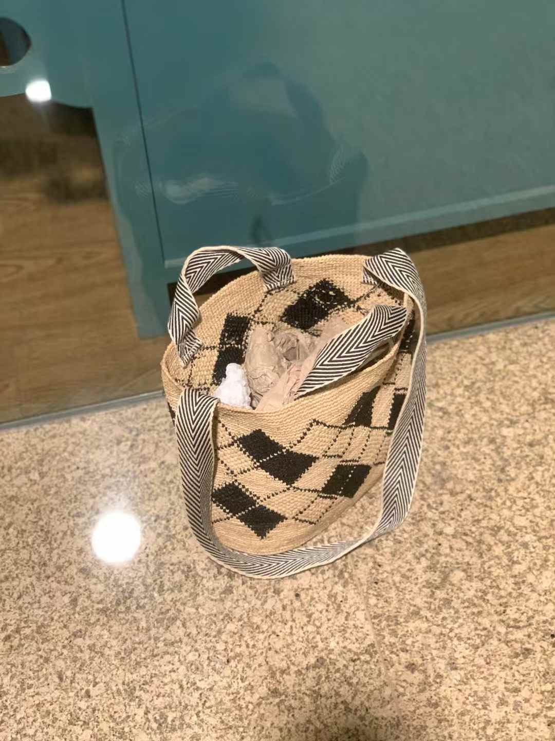 Raffia Bag in classic tote shape, flat bottom, black diamond pattern, wide, black-and-white striped handles and long cotton strap