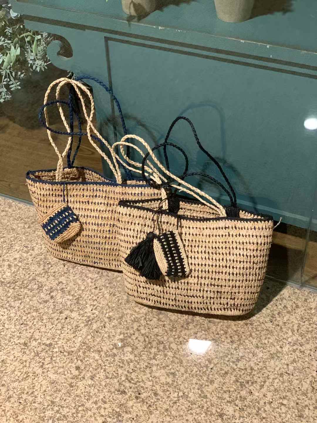 raffia tote bag in natural tone with black or navy at the edge