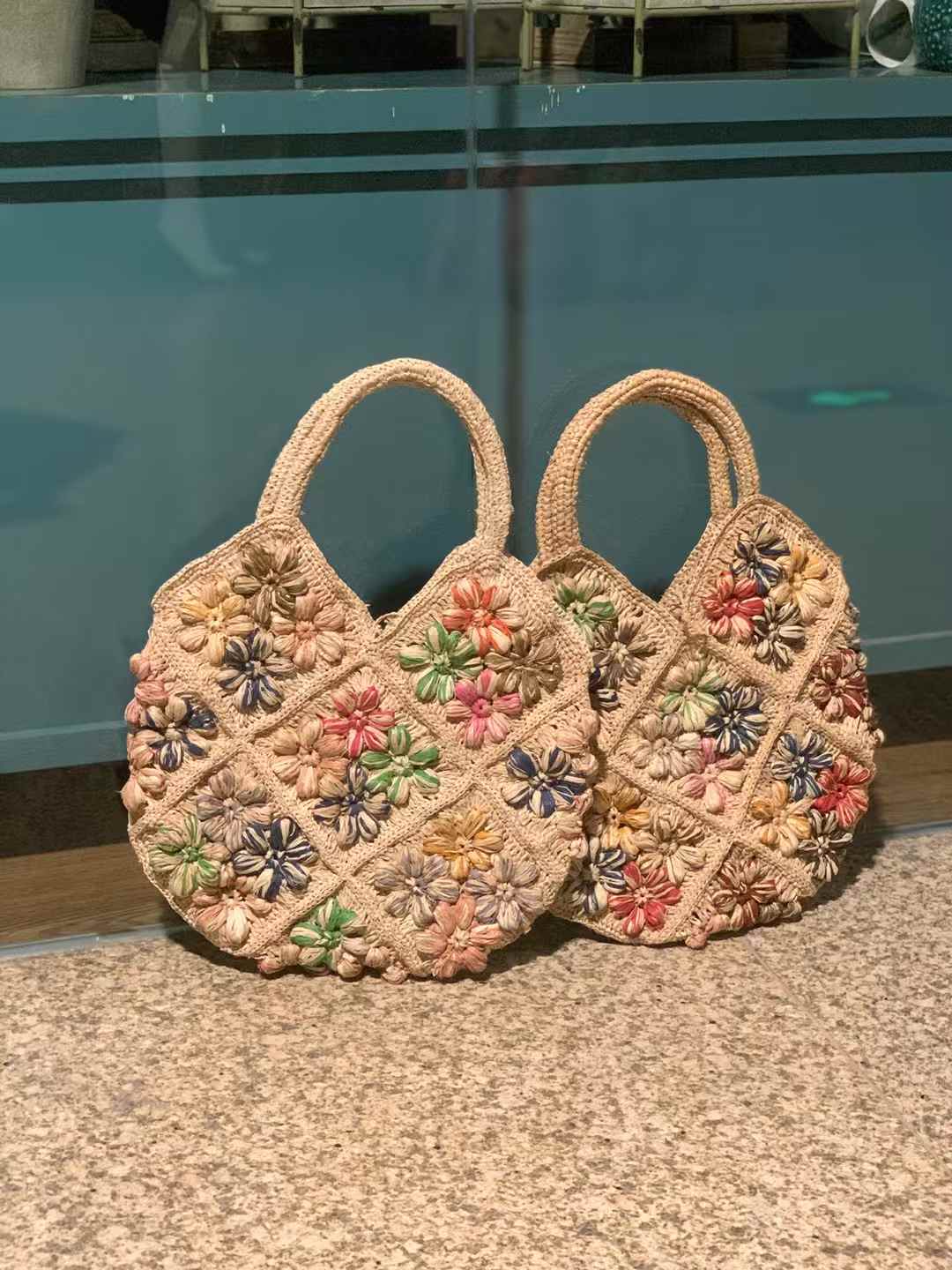 2 flower straw bag made in crochet technique with colorful crochet flower design, featuring natural tones, two top handles — perfect for summer beach or casual wear