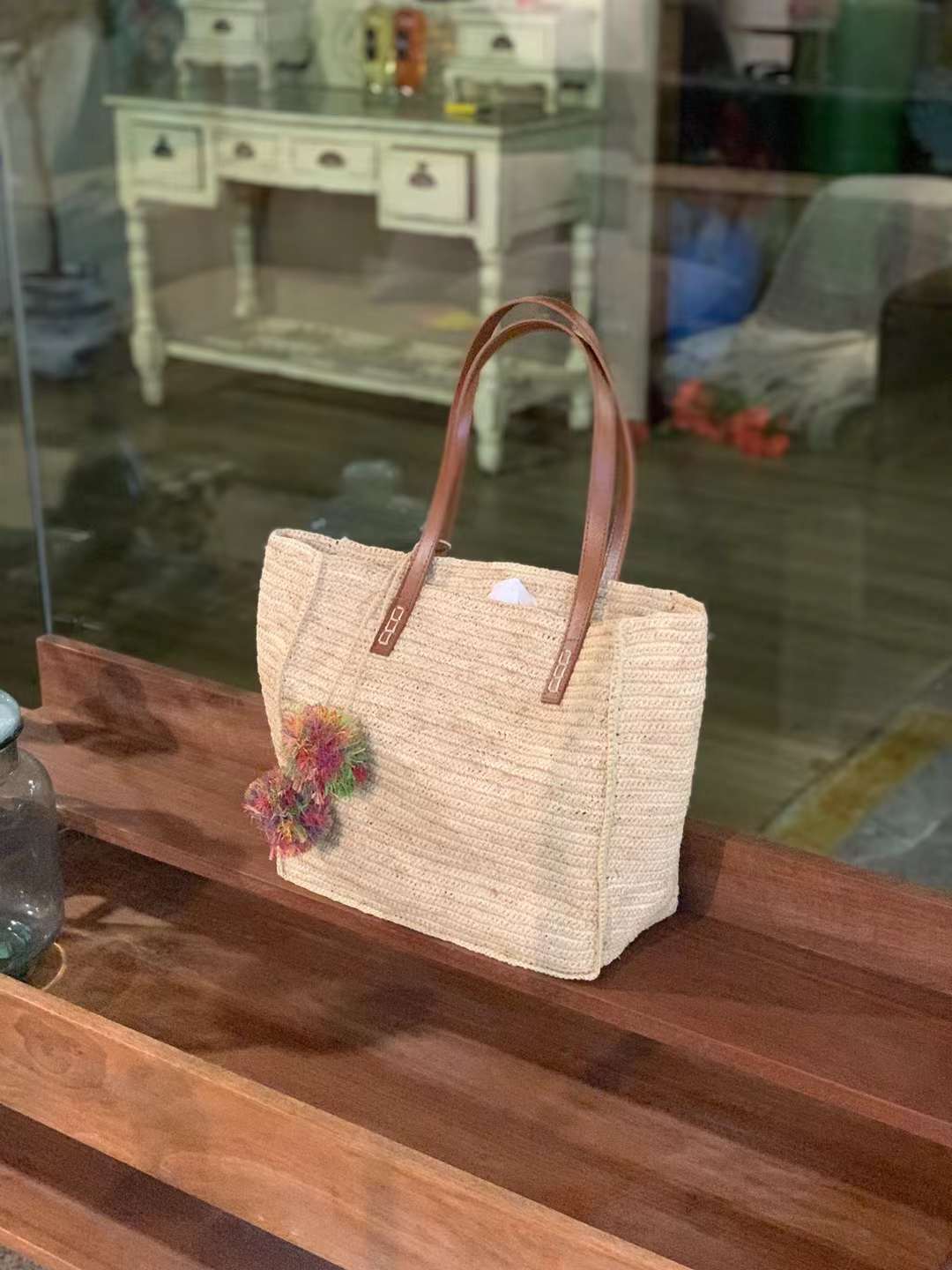 Beige Straw bag With Leather Strap And colorful pompom bag charm